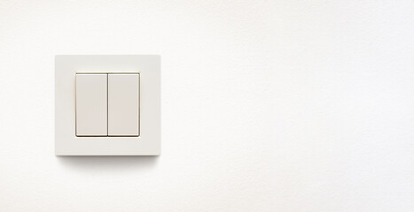 Cream colored wall mounted cream colored double light switch