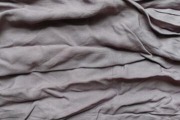 Obraz premium A crumpled gray cloth and and exposed to the light