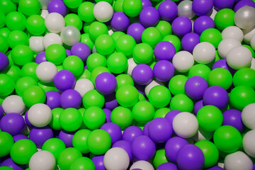 Colorful Plastic Balls for Dry Pool. Green, white and purple balls for the children's room.