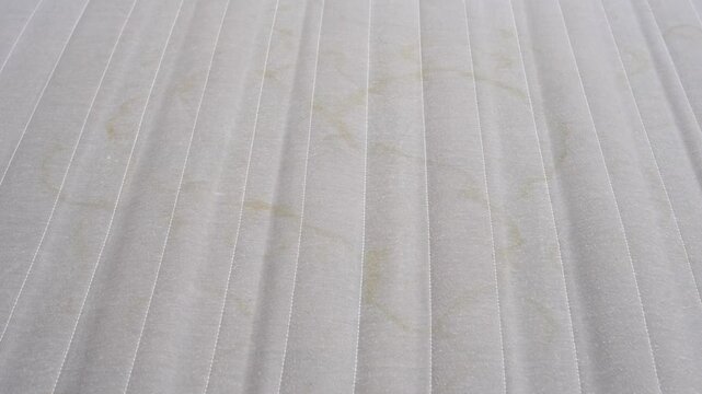close up. an old gray spring mattress. wear and tear of mattresses.