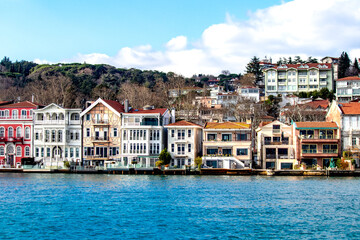 Blue sea and colorful mansions of Yeniköy. Historical buildings and mansions. Touristic destination of Istanbul. Architecture idea concept.