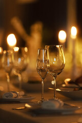 Elegant dinner setting with candlelight and sparkling glasses for a romantic evening