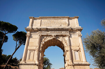 Obraz premium The Arch of Titus, an ancient Roman triumphal arch in Rome, Italy