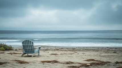 Tranquil Beach Scene with Lonely Chair by Ocean Waves and Sand