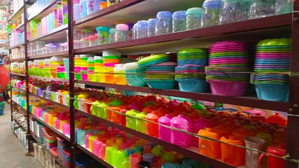 Jakarta, Indonesia-January 26, 2025- Rows of plastic cups and plates neatly arranged on shop shelves
