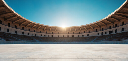 Modern stadium with a bright sunset and clear blue sky.