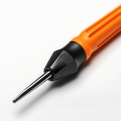 Fototapeta premium A screwdriver with an orange handle and a black end. The screwdriver has a thin, pointed tip.