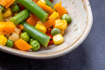 Mexican Mix of Vegetables. Tomatoes, Green Beans, Peas, Corn. Dietary Food.Bright vegetable mix .Vegetarian food.Assorted.