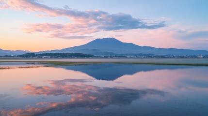 Fototapeta premium Serene mountain reflection at sunset in a peaceful landscape, with pink and blue colors