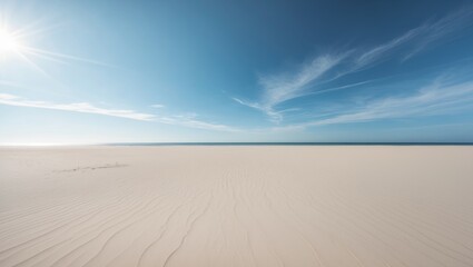Serenity of a beach with golden sand and clear blue sky during midday.