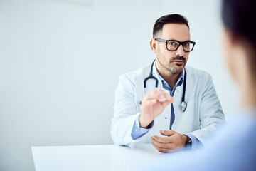 Doctor Engaging in a Professional Discussion with a Patient in a Medical Setting