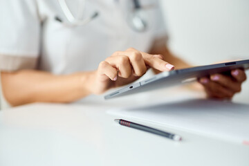 Healthcare Professional Using a Tablet for Digital Record Management