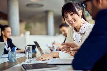 Collaborative Business Team Discussing Project Ideas in a Modern Office Setting