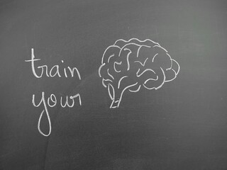 Train your brain chalkboard illustration promoting cognitive exercise