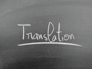 Obraz premium The word 'translation' written in chalk on a blackboard underlined for emphasis