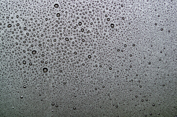 Top view of droplets on dark background