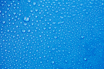 Top view of water droplets with light blue color background suitable for wallpaper. water droplets concept