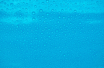 Fototapeta premium Top view of water droplets with light blue color background suitable for wallpaper