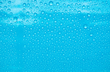 Top view of water droplets with blue color background suitable for wallpaper