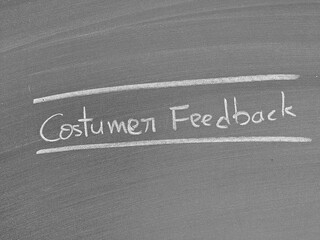 Costumer feedback written in chalk on a blackboard