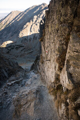 Climbing, high mountain trekking in the High Tatras. Belay elements in the mountains, buckles, chains and ladders.
