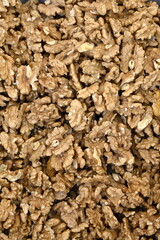Detail of cracked walnuts on the market. Walnuts on the market. Cracked walnuts cores, nuts as background.