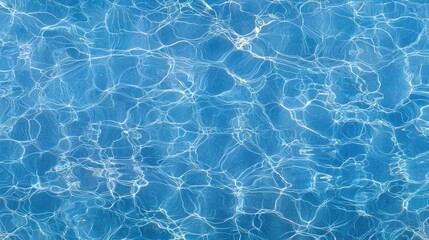 Obraz premium A tranquil swimming pool surrounded by lush greenery under a clear blue sky on a sunny day