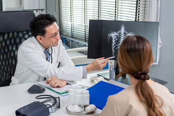 Obraz premium Asian young woman visit and consult health problem with doctor in hospital. 