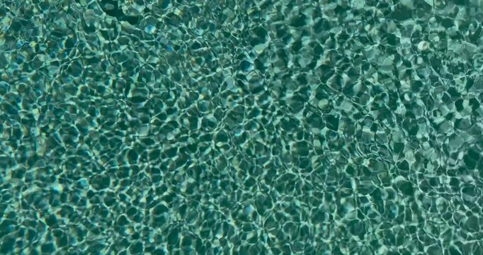 Ripples of water in a swimming pool.