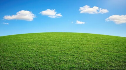 Obraz premium Serene Green Hill Under a Blue Sky