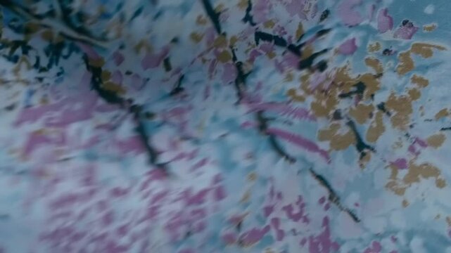 Fabric with a beautiful multi-colored pattern flutters in the wind. Closeup. Macro