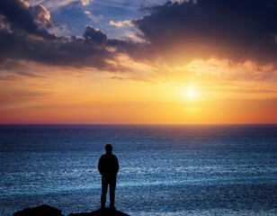 Solitary Silhouette Contemplating the Endless Ocean