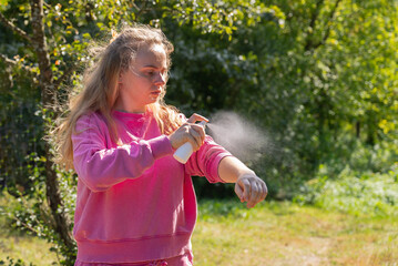 Young woman using insect sprays disease prevention. Protection against mosquito bite during...