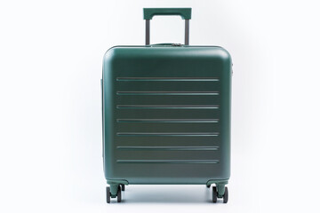 Green suitcase on white background close-up front view, travel concept.