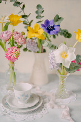 Elegant Breakfast Table Setting with Spring Flowers in Soft Tones