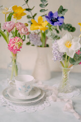 Elegant Breakfast Table Setting with Spring Flowers in Soft Tones