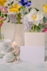 Mockup card on Elegant Breakfast Table Setting with Spring Flowers in Soft Tones