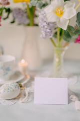 Mockup card on Elegant Breakfast Table Setting with Spring Flowers in Soft Tones