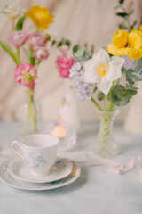 Elegant Breakfast Table Setting with Spring Flowers in Soft Tones