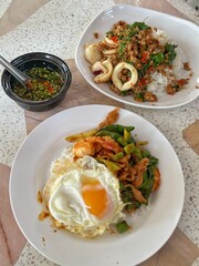 Rice topped with stir-fried pork and basil, Rice topped with stir fried minced pork and basil with Fried egg