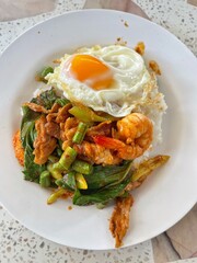Rice topped with stir-fried pork and basil, Rice topped with stir fried minced pork and basil with Fried egg