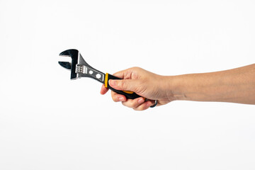 Hand holding a wrench isolated on white background.