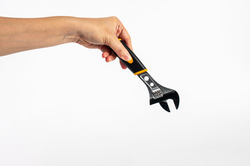 Hand holding a wrench isolated on white background.