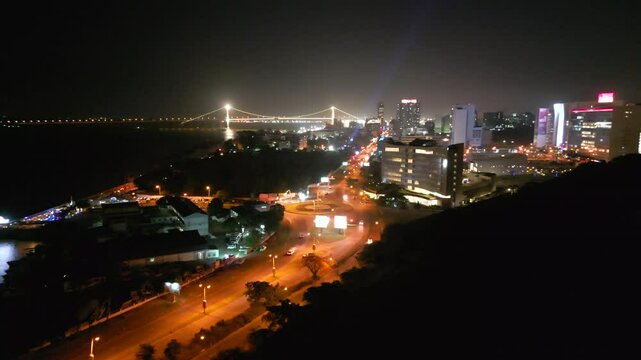 City Of Maputo In Mozambique At Night. Praca dos Trabalhadores, Maputo Katembe Bridge, Amd Maputo Bay In View. aerial shot