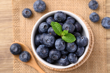 Blueberries in bowl with spoon, Healthy fruit, Food ingredient, Table top view