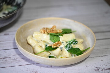 Homemade Potato Gnocchi with Spinach, Blue Cheese, and Walnuts – Creamy Sauce