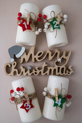 Merry Christmas wooden message Traditional four advent weeks calendar before Christmas holidays. Candles and plastic free zero waste sustainable decoration. Copy space greeting card mock up template