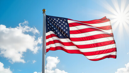 Fototapeta premium American flag waving in blue sky with white clouds, patriotic symbol