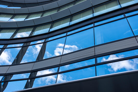 Apartment facade in London rise against the urban skyline, reflecting the city's dynamic mix of architecture. These residential buildings showcase modern living in a bustling metropolis, blending sty