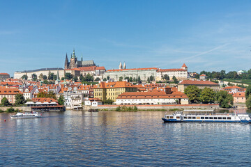 Spring Prague gothic Castle with the Lesser Town above River Vltava in the sunny Day, Czech Republic